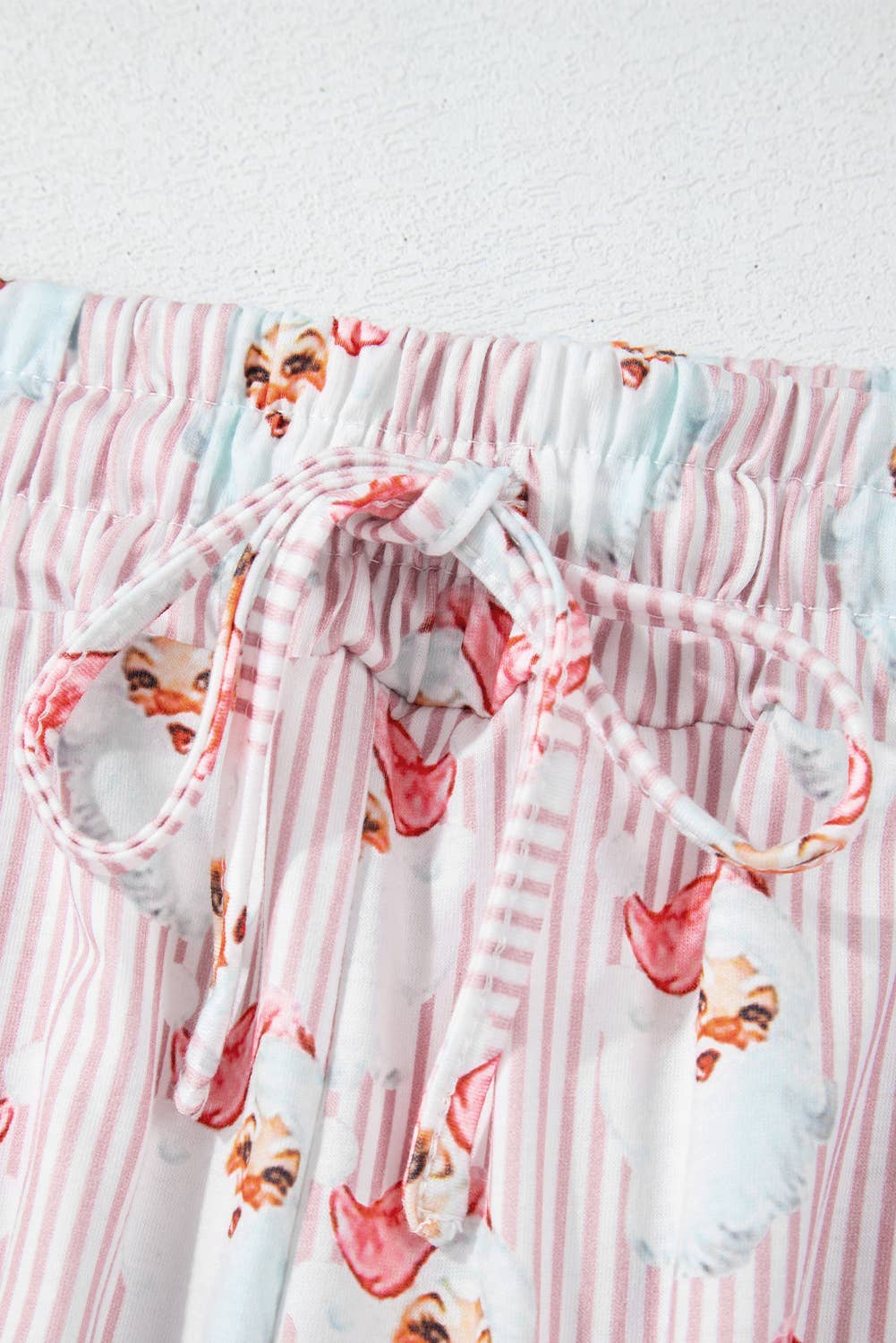 Santa Claus and striped fabric with a white background