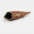 Red, green and cream geometric jacquard glasses case unzipped to show the dark lining, with width and height marked