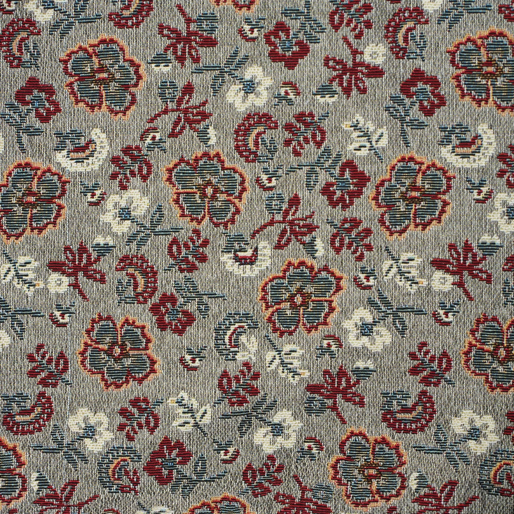 Close-up of the woven jacquard pattern on the burgundy and gray floral jacquard small pouch and coin purse
