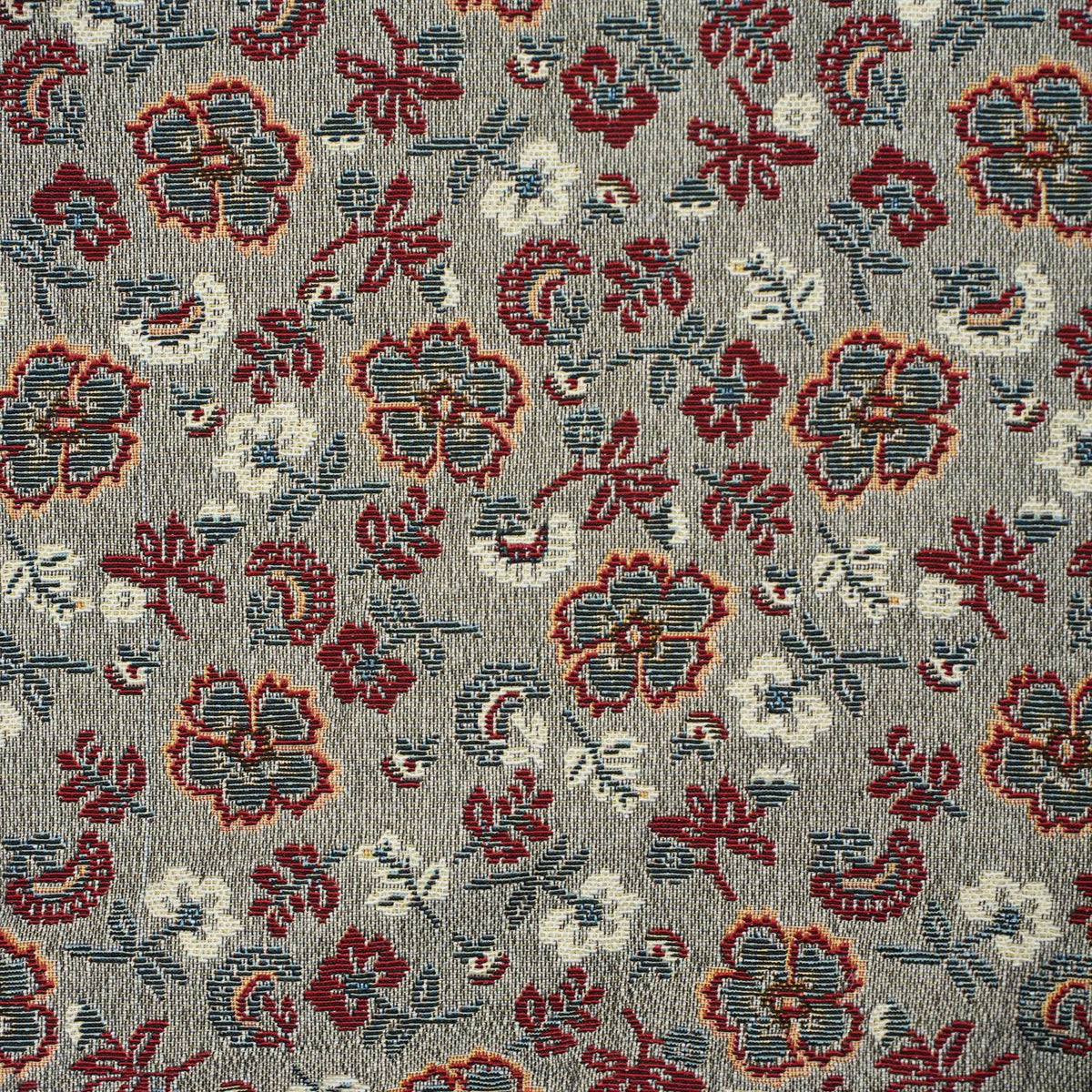 Close-up of the woven jacquard pattern on the burgundy and gray floral jacquard small pouch and coin purse