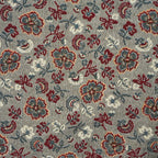 Close-up of the woven jacquard pattern on the burgundy and gray floral jacquard glasses case