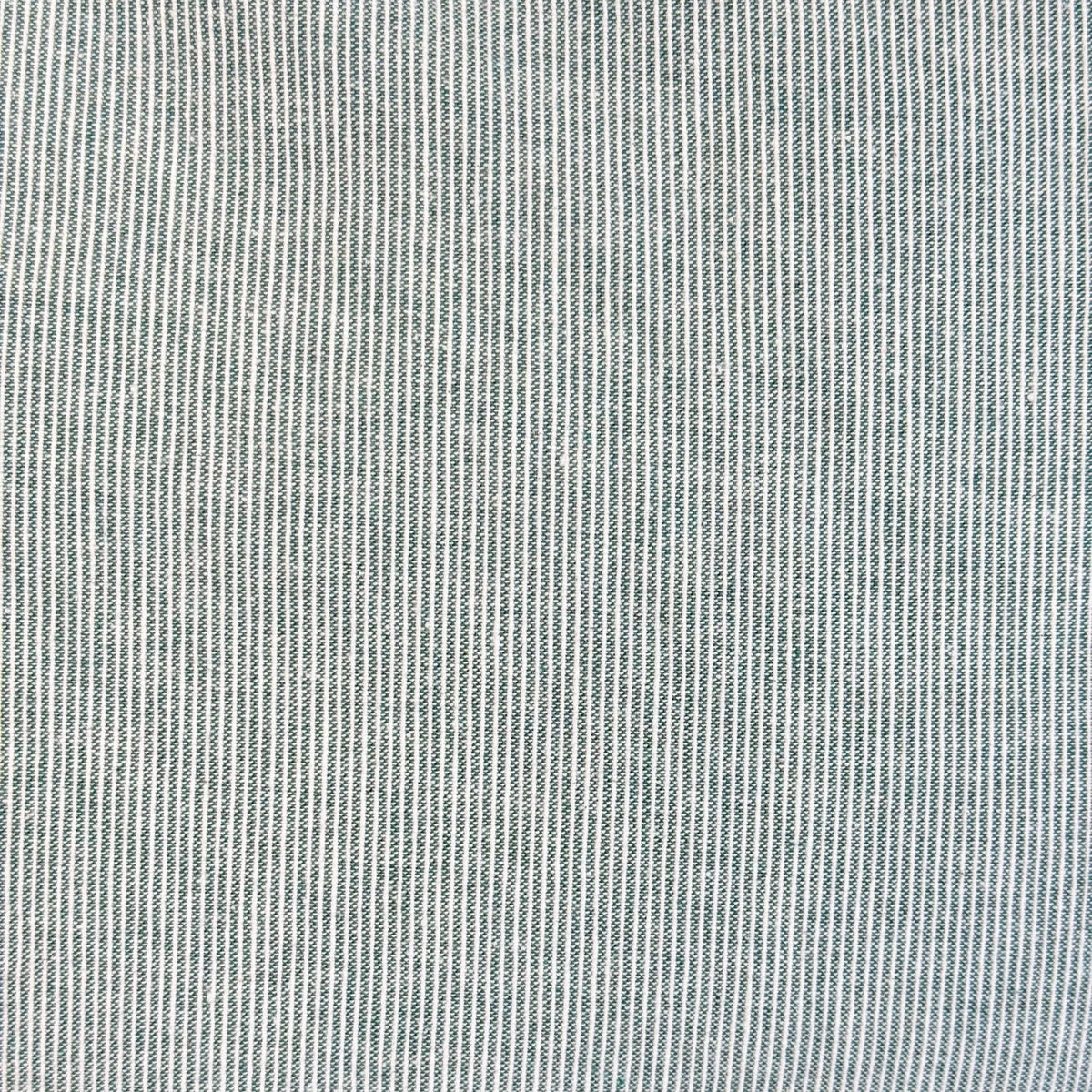 Close-up of the fine sage green and cream striped cotton weave