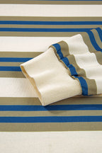 Folded beige and brown striped fabric on a striped background