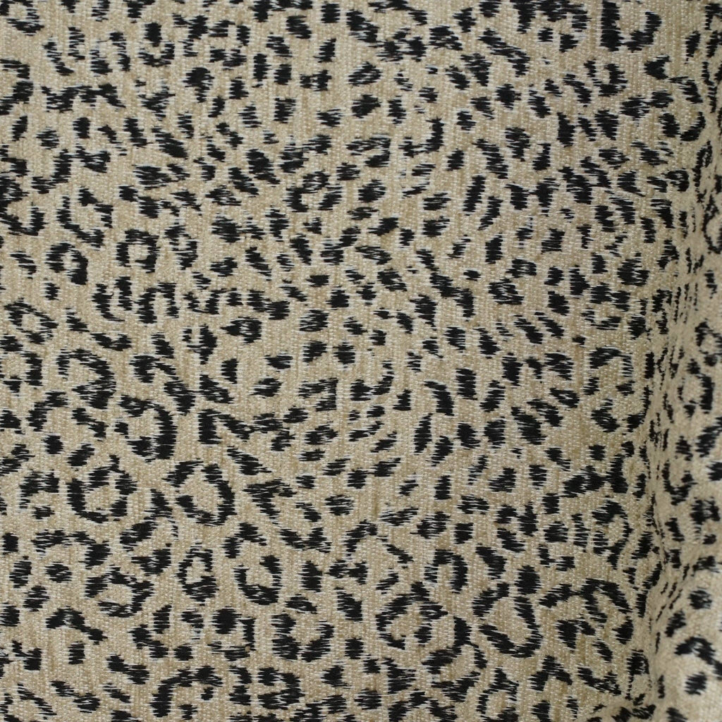 Close-up of the woven black leopard print on beige jacquard
