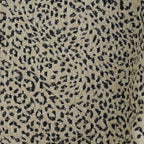 Close-up of the woven black leopard print on beige jacquard