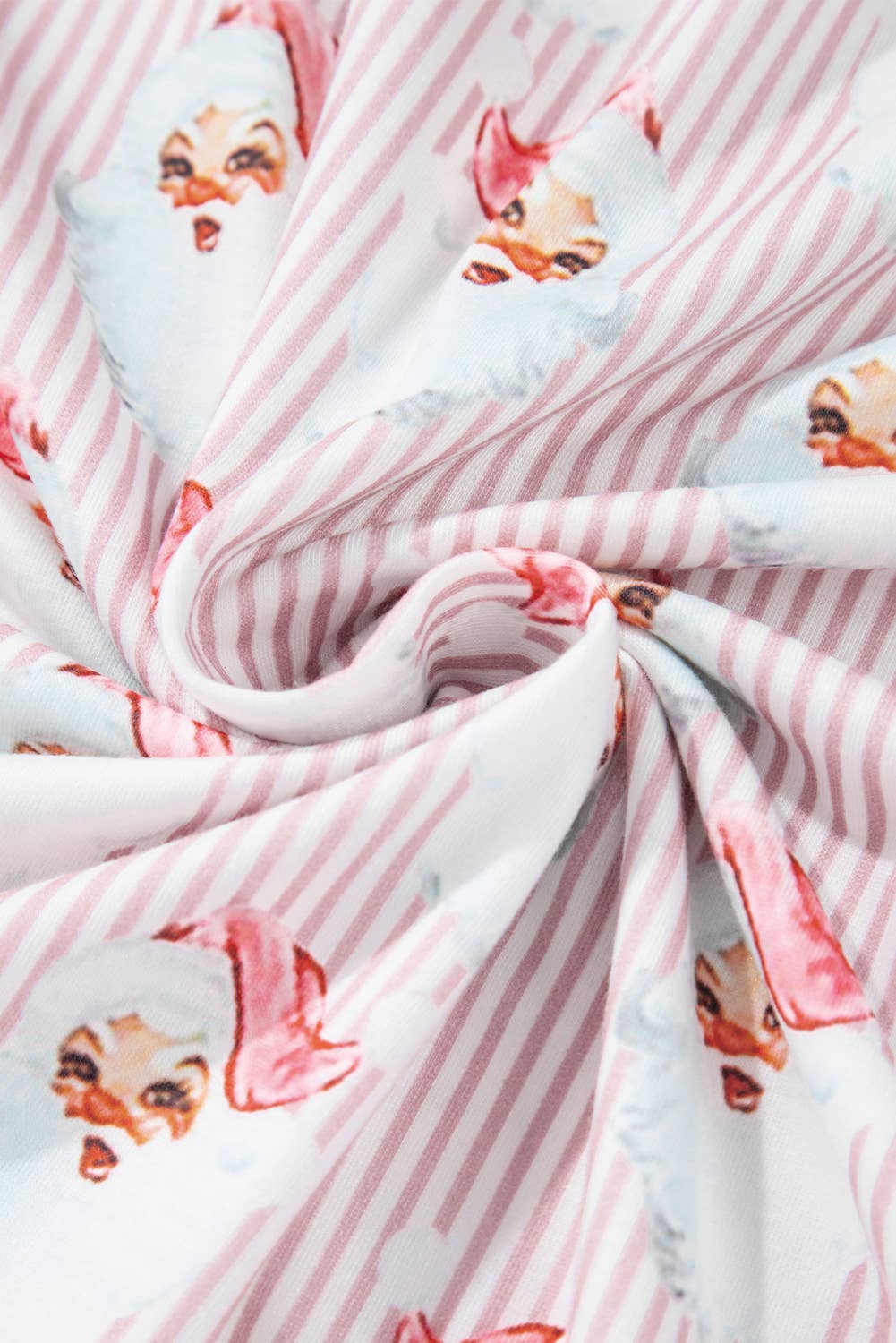 Fabric with Santa Claus print on a pink and white striped background