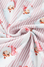 Fabric with Santa Claus print on a pink and white striped background