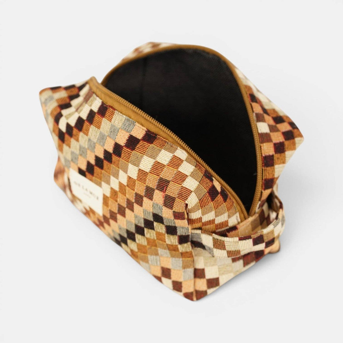 Brown and beige zigzag jacquard squared makeup bag unzipped to show the dark lining