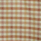 Close-up of the woven gingham pattern on the terracotta and mustard squared makeup bag