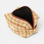 Terracotta and mustard gingham jacquard squared makeup bag unzipped to show the dark lining